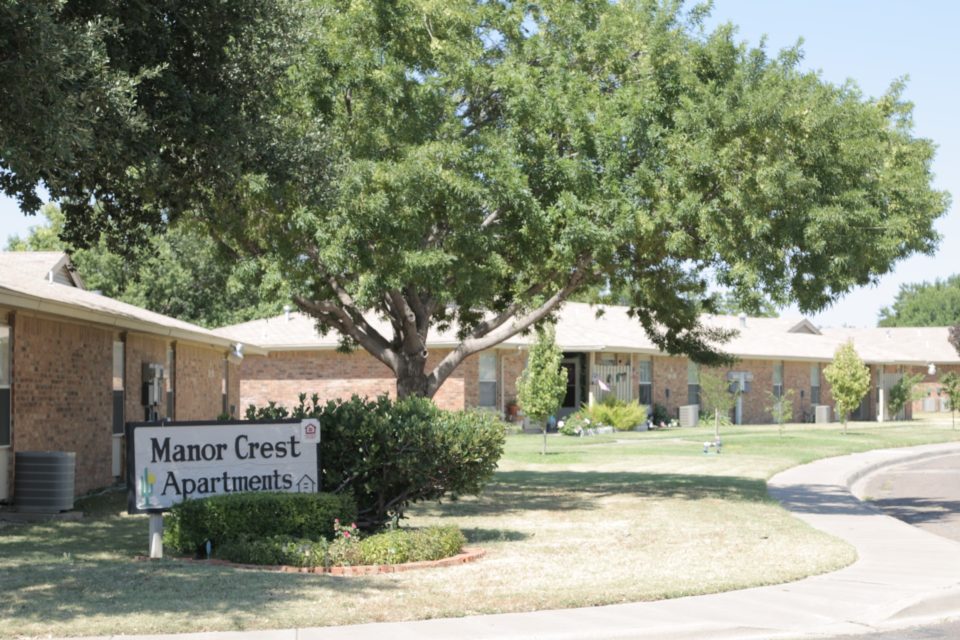 Manor Crest Apartments sign